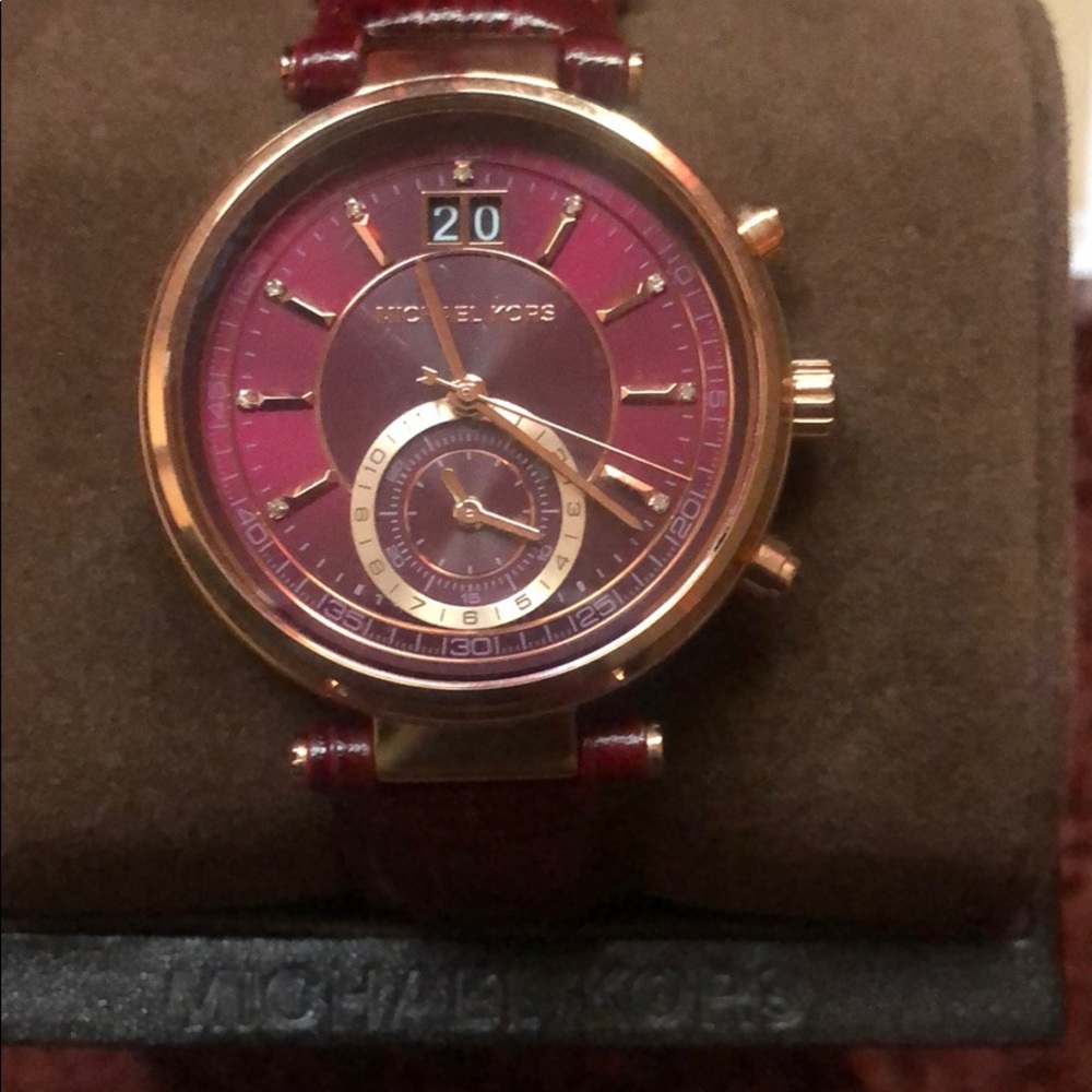 Women’s MK leather strap watch. Couple years old.